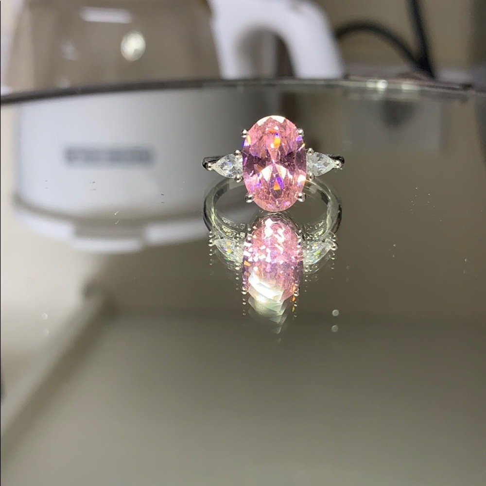 pink oval ring w/ teardrop side stones